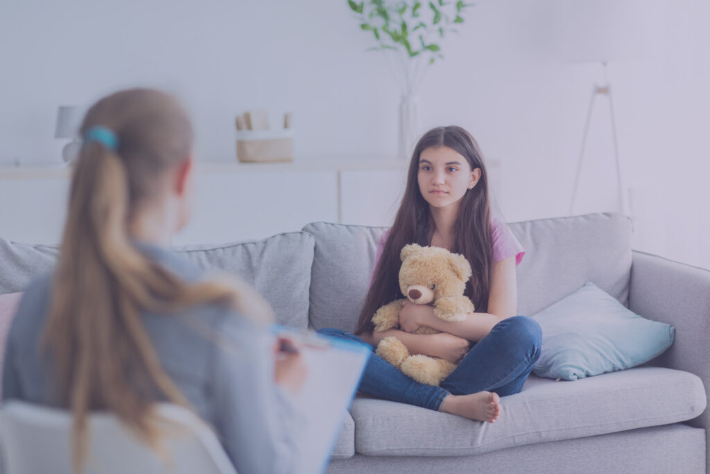 Girl sitting on the sofa to meet with a counselor